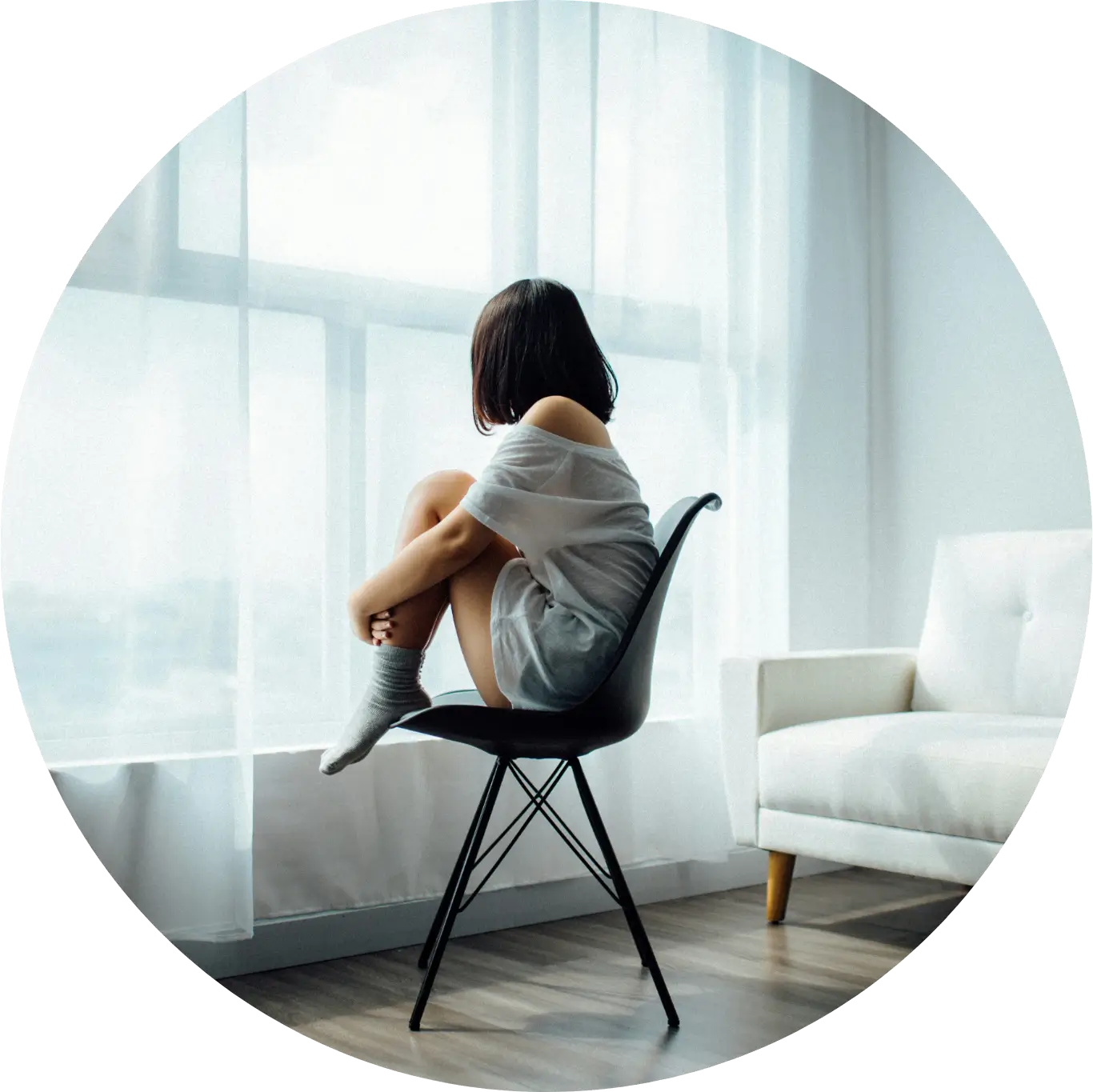 Single Girl in Single Chair in Room