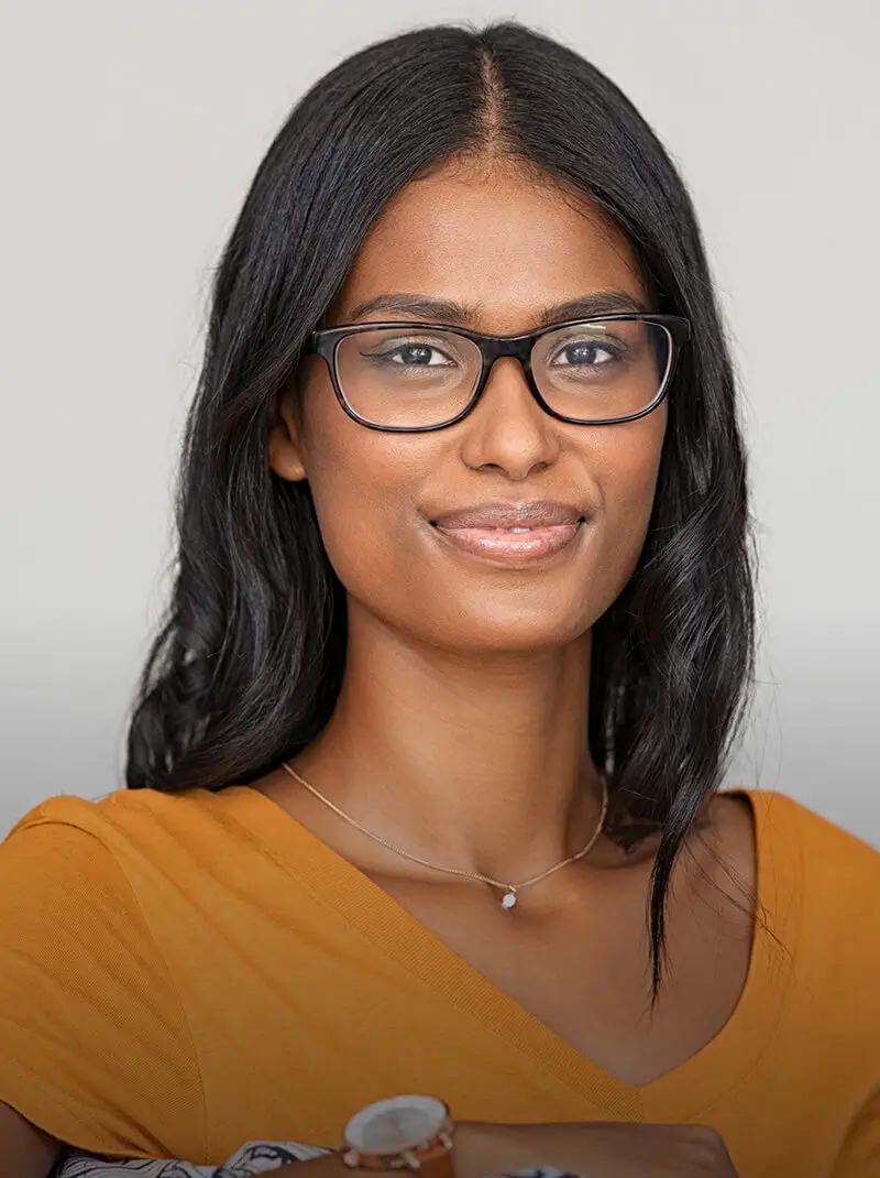 Woman with glasses looking straight ahead